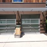 Photo of 2 grey metal residential garage doors